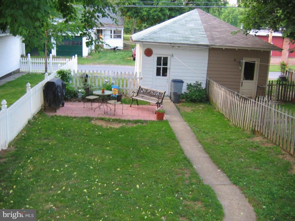 339 Front Street Lititz, PA 17543 - Photo 15 of 16 a front view of a house with a yard and outdoor seating