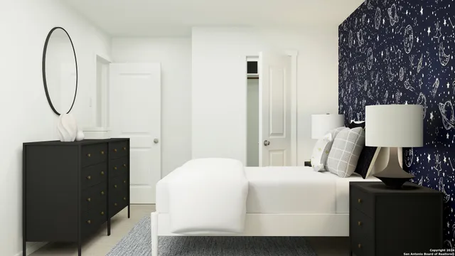 a bedroom with a bed and a table