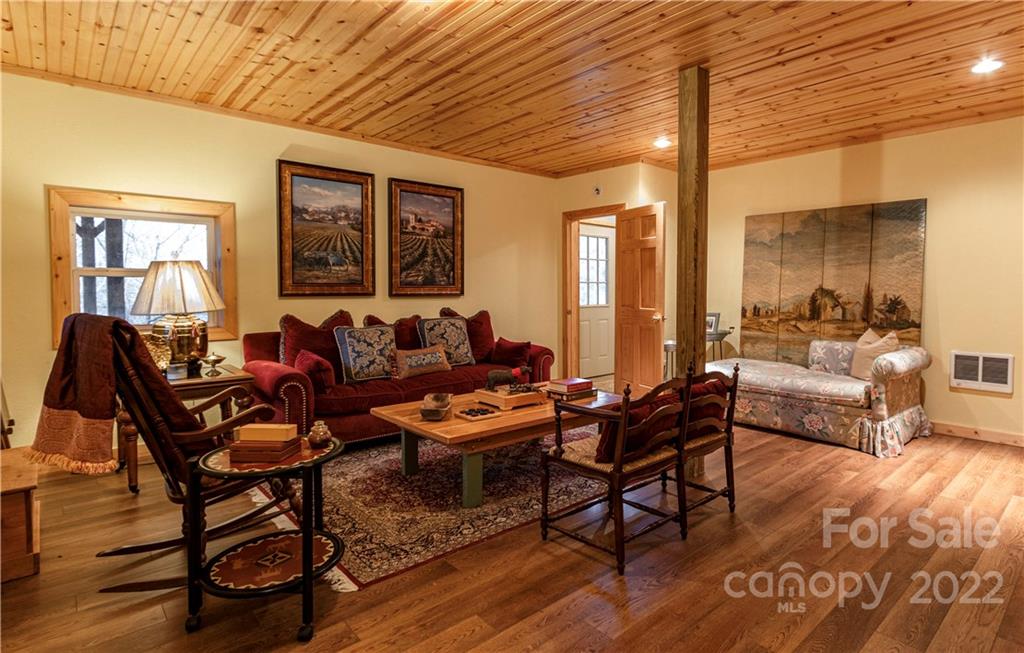 903 Davenport Road, Unit 12 Spruce Pine, NC 28777 - Photo 28 of 39 a living room with furniture and a wooden floor