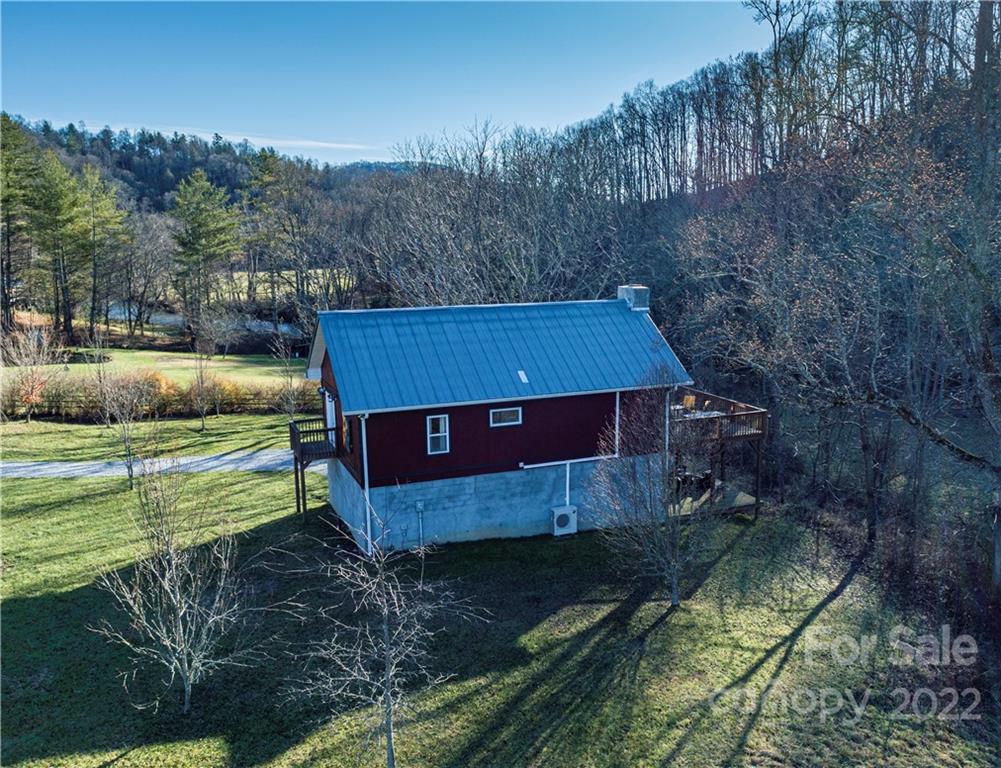 903 Davenport Road, Unit 12 Spruce Pine, NC 28777 - Photo 5 of 39 a view of a small house with a yard