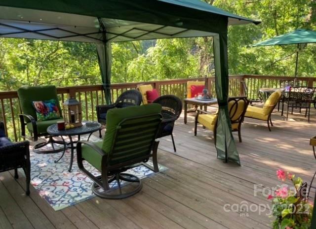 903 Davenport Road, Unit 12 Spruce Pine, NC 28777 - Photo 8 of 39 a view of a chairs and table in patio