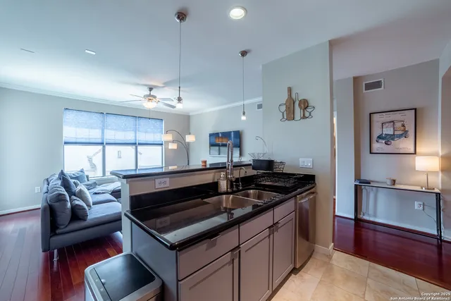 a kitchen with a stove a sink and a refrigerator