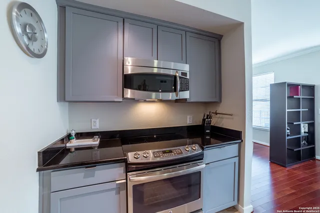 a kitchen with a stove and a microwave