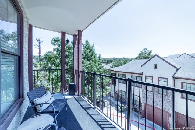 a view of balcony with furniture and wooden deck