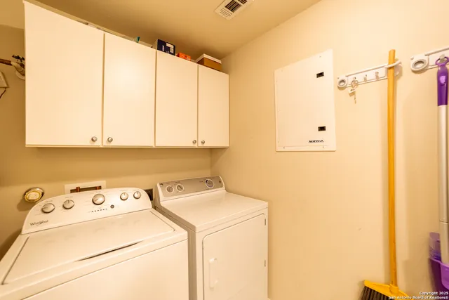 a utility room with dryer and washer