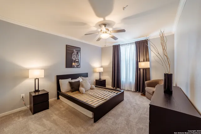 a bedroom with furniture and a lamp