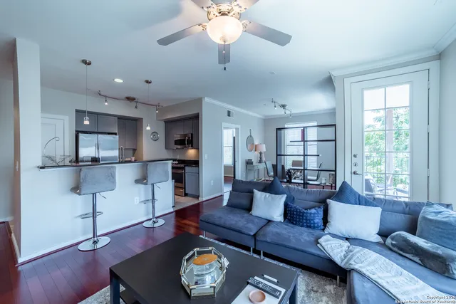 a living room with furniture and a large window