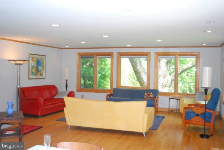 709 East Franklin Avenue Silver Spring, MD 20901 - Photo 2 of 9 a living room with furniture and large windows