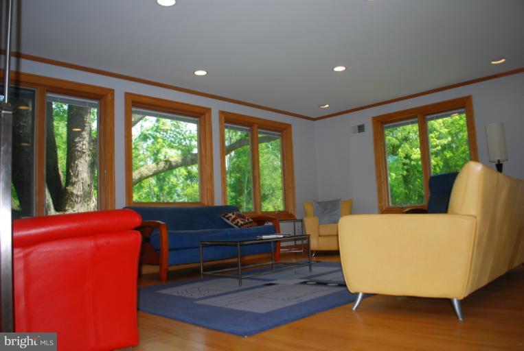 709 East Franklin Avenue Silver Spring, MD 20901 - Photo 7 of 9 a living room with furniture and a large window