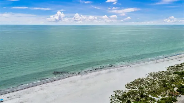 a view of a city with an ocean