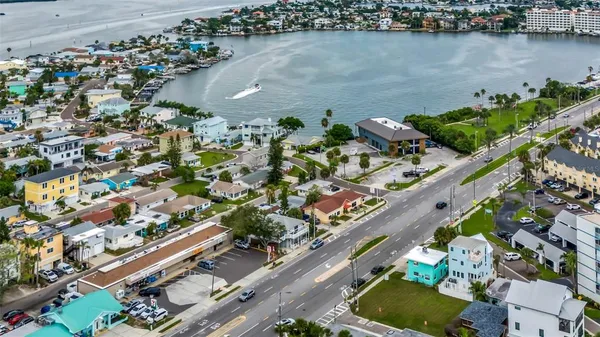 an aerial view of lake and residential houses with outdoor space