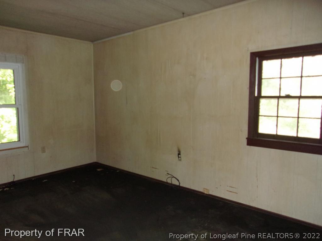 1877 H B Lewis Road Clinton, NC 28328 - Photo 6 of 10 an empty room with a window