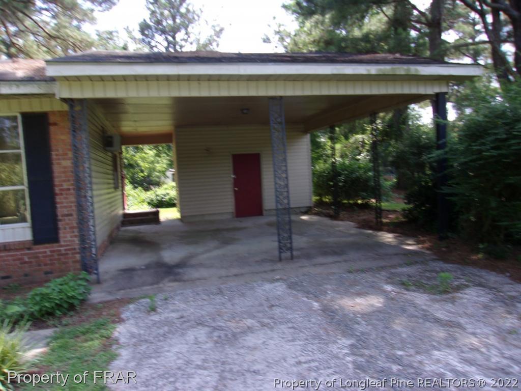1877 H B Lewis Road Clinton, NC 28328 - Photo 9 of 10 a view of a house with a porch