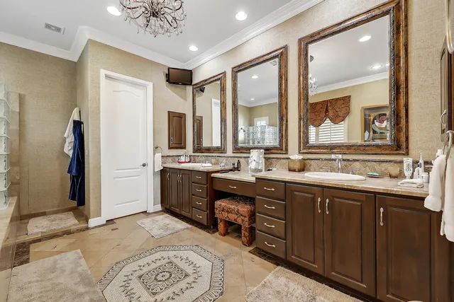 a spacious bathroom with a double vanity sink a mirror and a shower