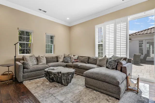 a living room with furniture and windows