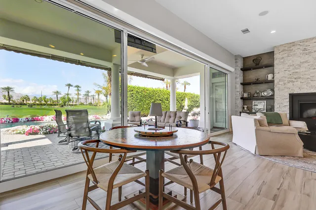 a view of a dining room with furniture window and outside view