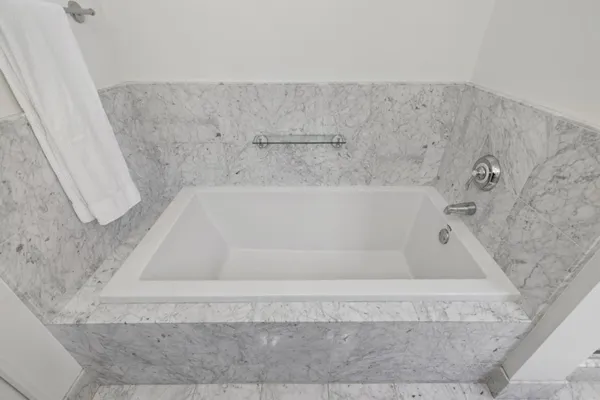 a bath tub sitting in a bathroom