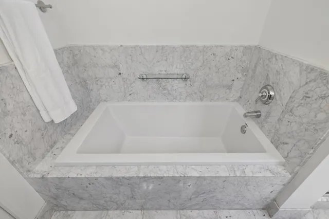 a bath tub sitting in a bathroom