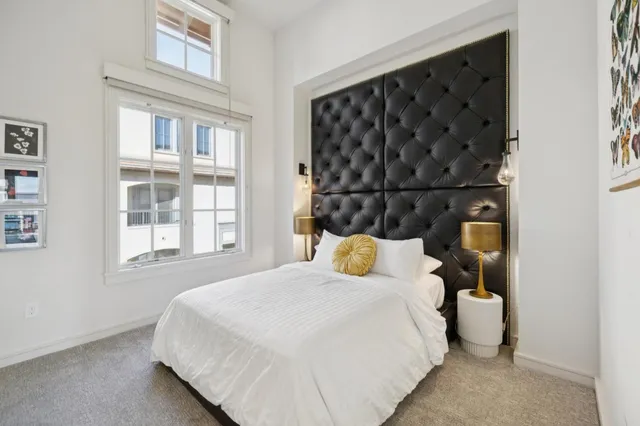 a bedroom with a bed and window