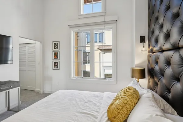 a bed room with a bed and a couch