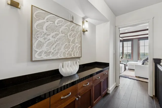 a living room with hard wood flooring and a couch