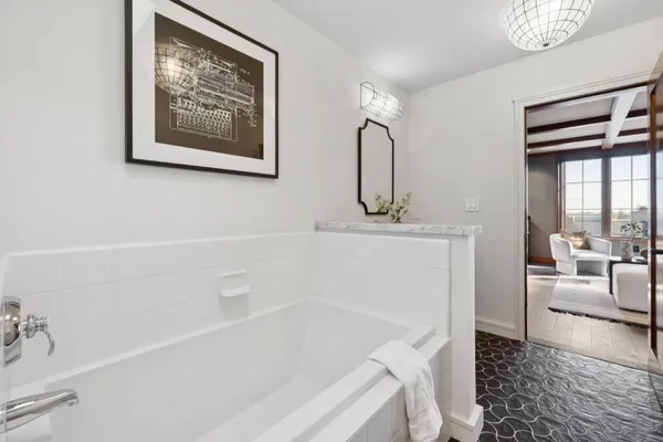 a bathroom with a bathtub and a sink