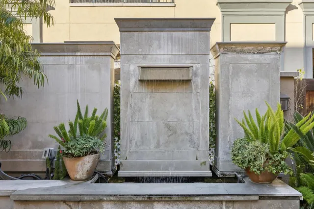 a white building with potted plants