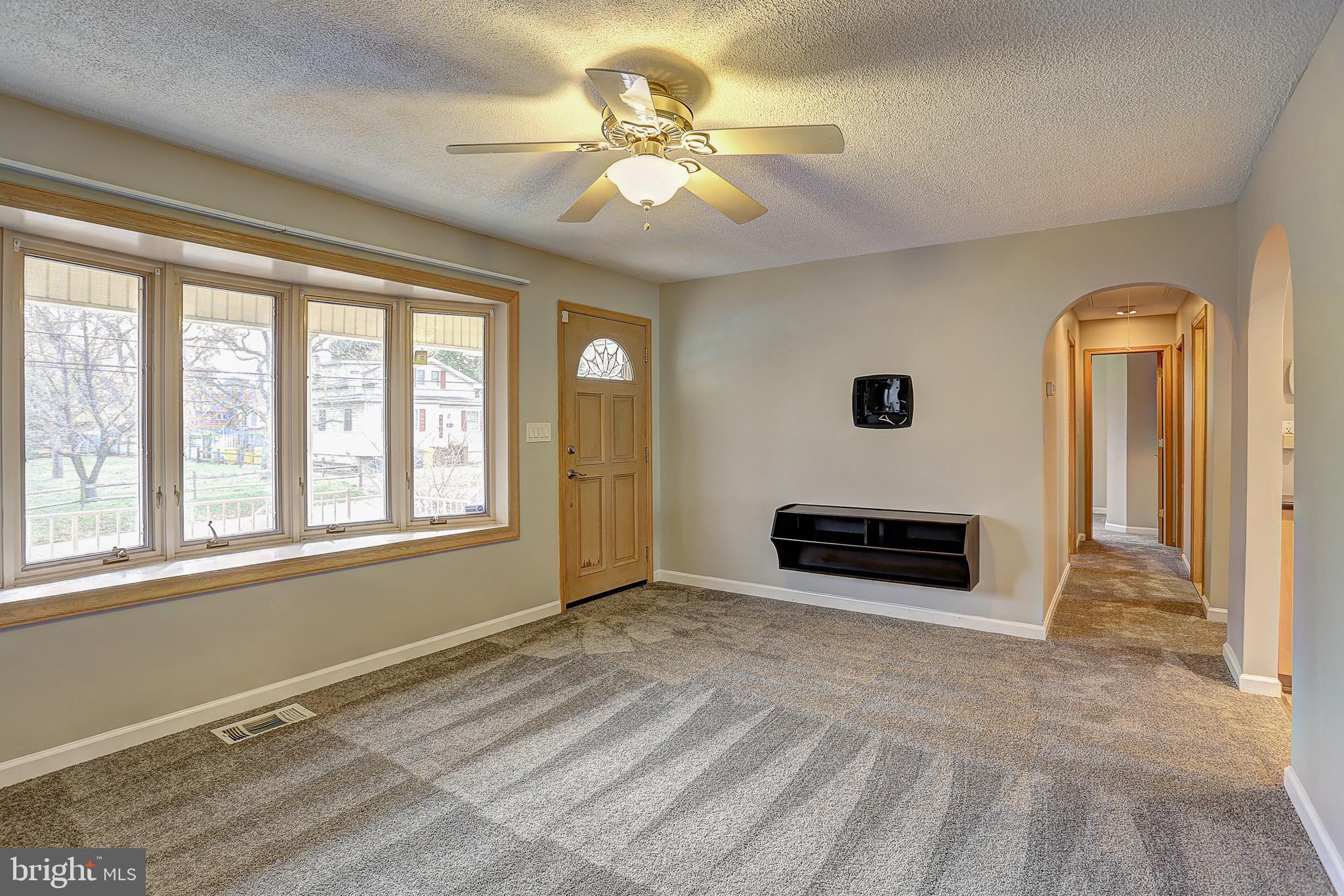 208 Inlet Drive Pasadena, MD 21122 - Photo 8 of 49 Entry Living Room with New Carpet & Bay Window