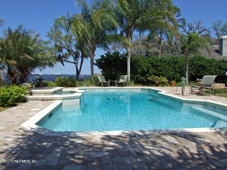 13120 Mandarin Road Jacksonville, FL 32223 - Photo 13 of 62 a view of a lake with palm trees