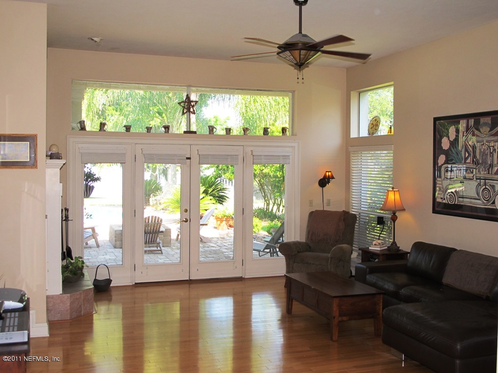 13120 Mandarin Road Jacksonville, FL 32223 - Photo 23 of 62 a living room with furniture and a large window