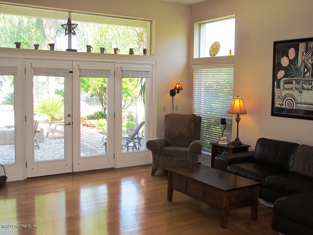 13120 Mandarin Road Jacksonville, FL 32223 - Photo 24 of 62 a living room with furniture and a large window
