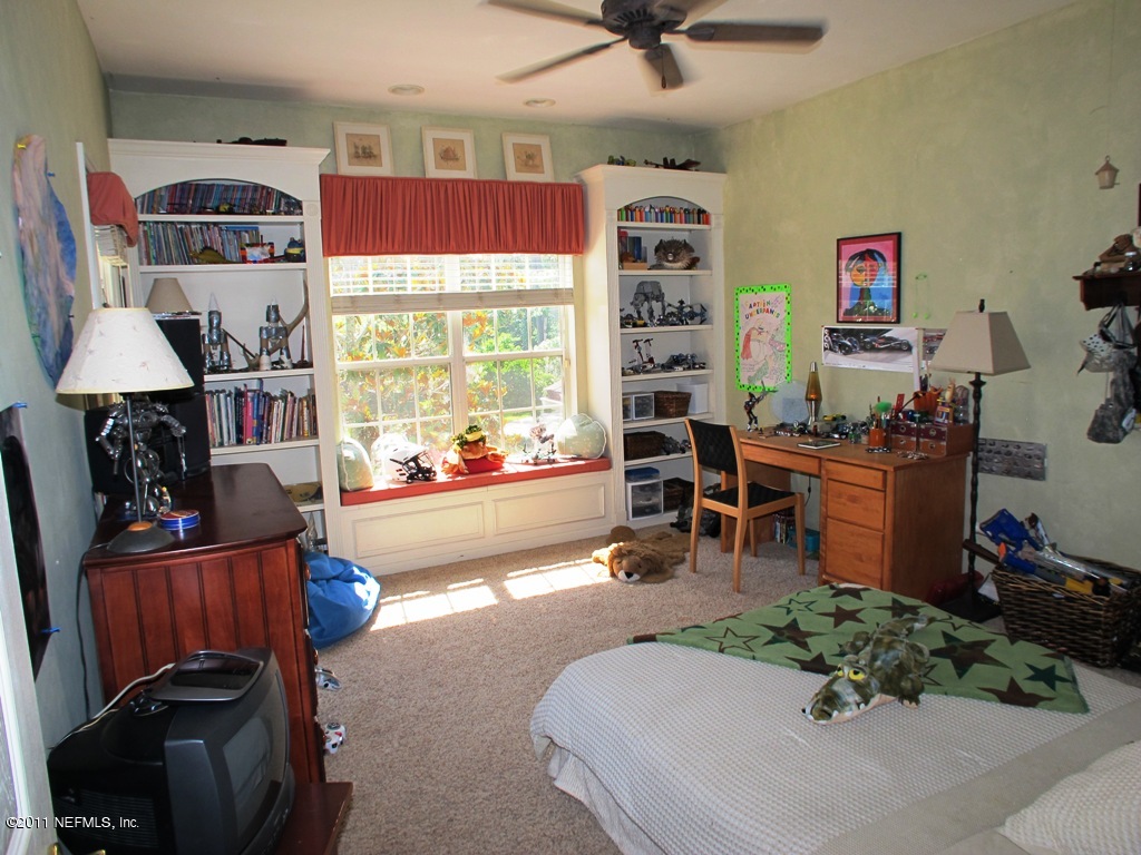 13120 Mandarin Road Jacksonville, FL 32223 - Photo 40 of 62 a room with furniture and a flat screen tv