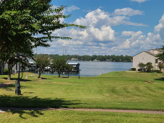 a view of a swimming pool with a yard