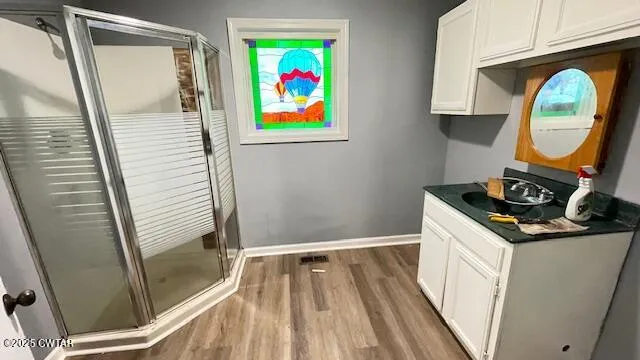 an empty room with a window and a ceiling fan