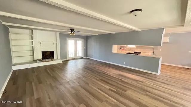 a kitchen with granite countertop white cabinets and a sink