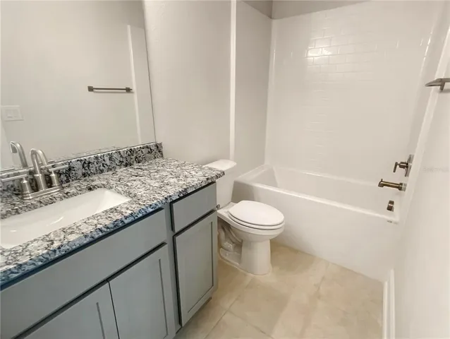 a view of a house with swimming pool and porch