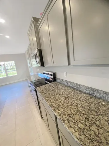 a kitchen with a sink and a stove