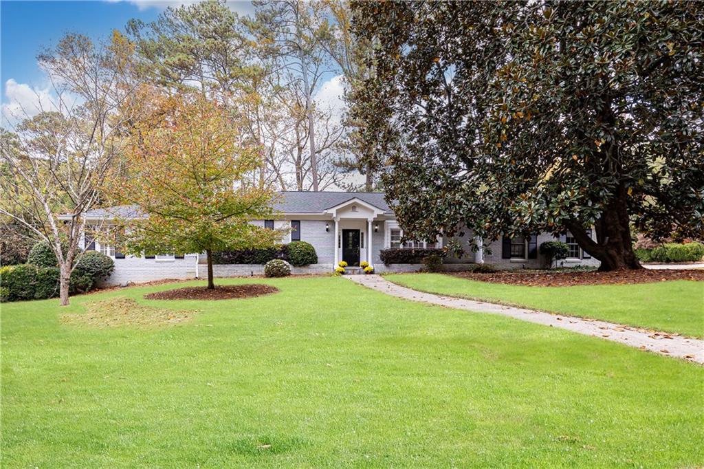 2830 West Roxboro Road Northeast Atlanta, GA 30324 - Photo 1 of 1 a house with swimming pool in front of it