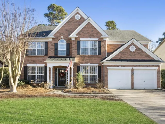 front view of a house with a yard