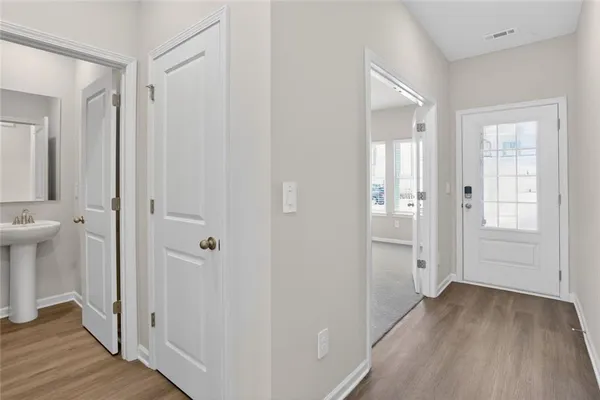 a view of a bathroom from a hallway