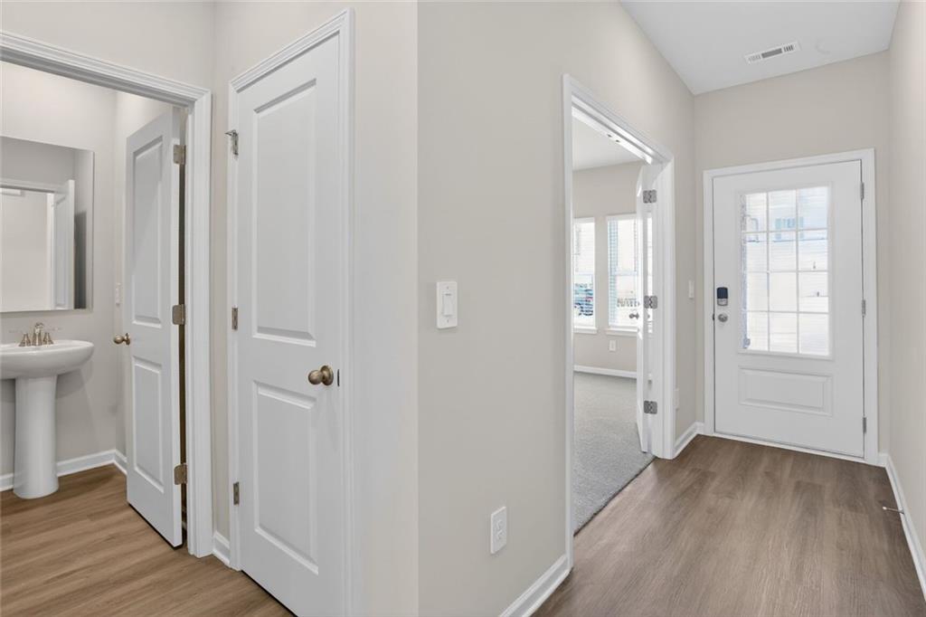 6929 Winchester Place Fairburn, GA 30213 - Photo 11 of 35 a view of a bathroom from a hallway