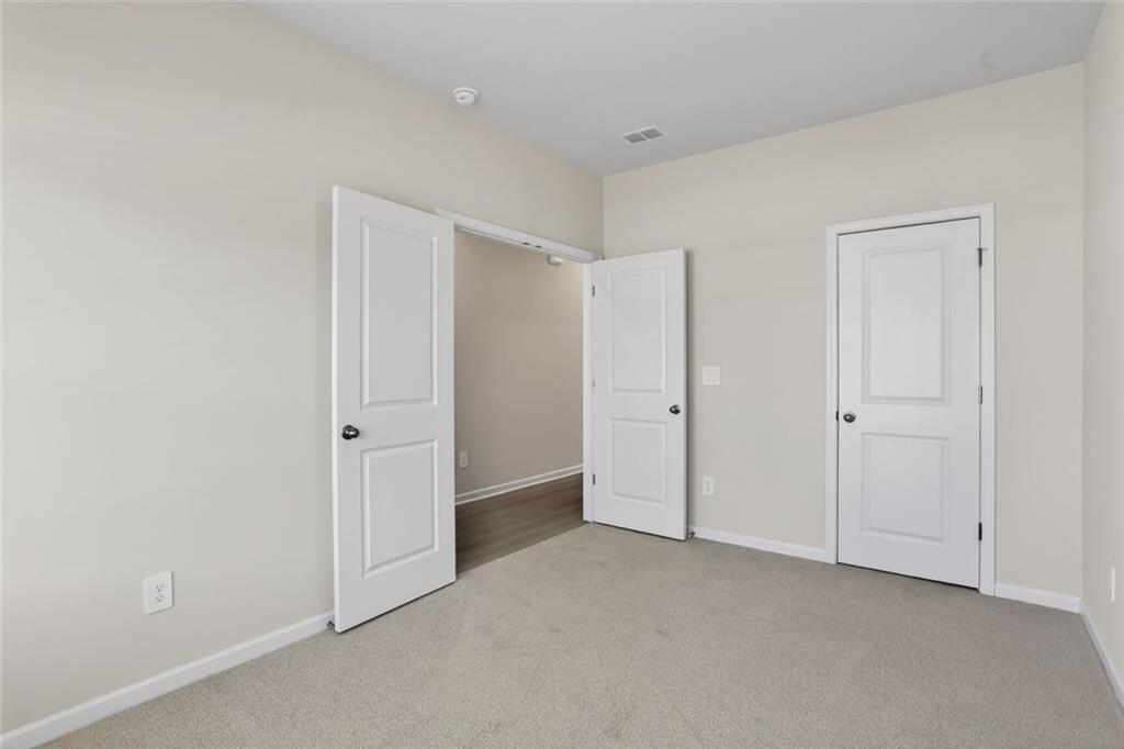 6929 Winchester Place Fairburn, GA 30213 - Photo 12 of 35 a view of an empty room