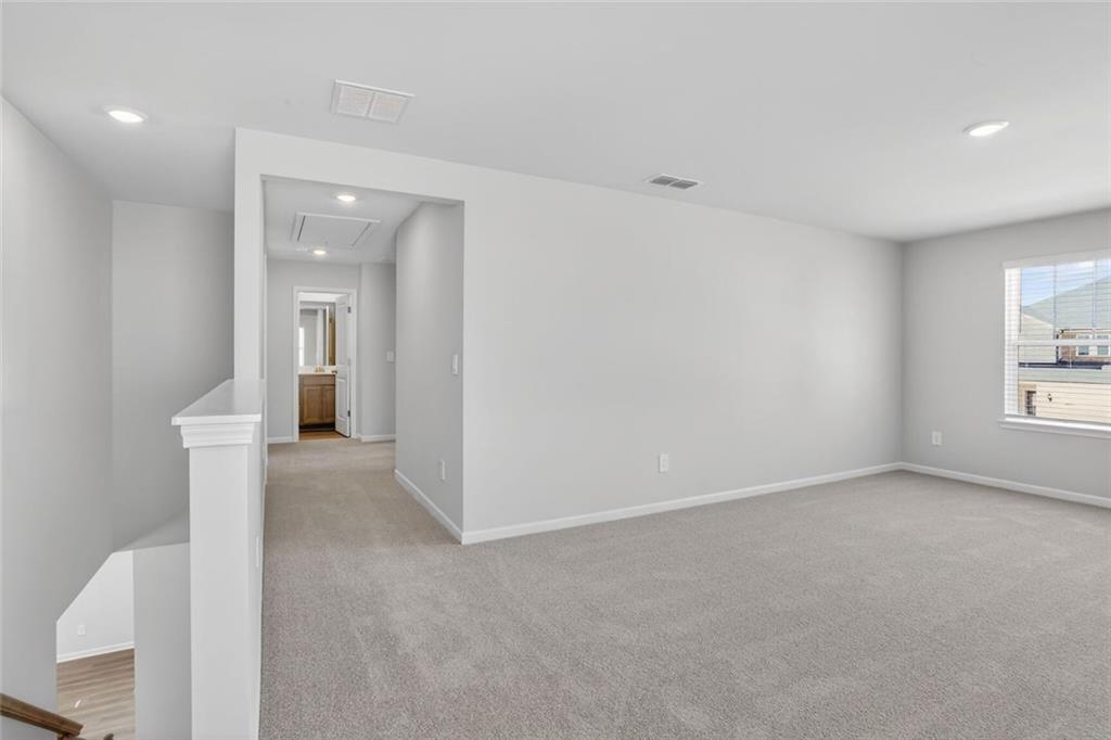 6929 Winchester Place Fairburn, GA 30213 - Photo 19 of 35 a view of an empty room and a window