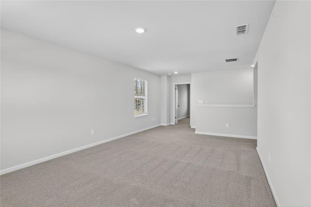 6929 Winchester Place Fairburn, GA 30213 - Photo 20 of 35 a view of an empty room with a window