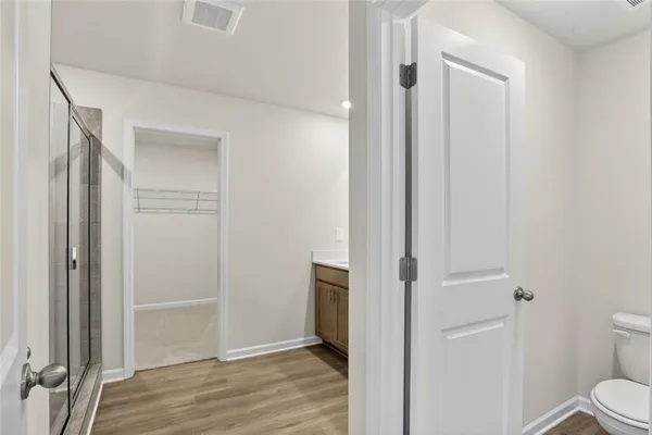 a view of a bathroom from a hallway