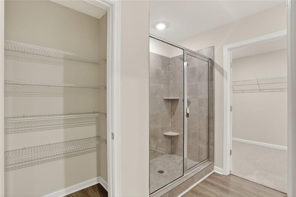 6929 Winchester Place Fairburn, GA 30213 - Photo 24 of 35 a bathroom with a shower