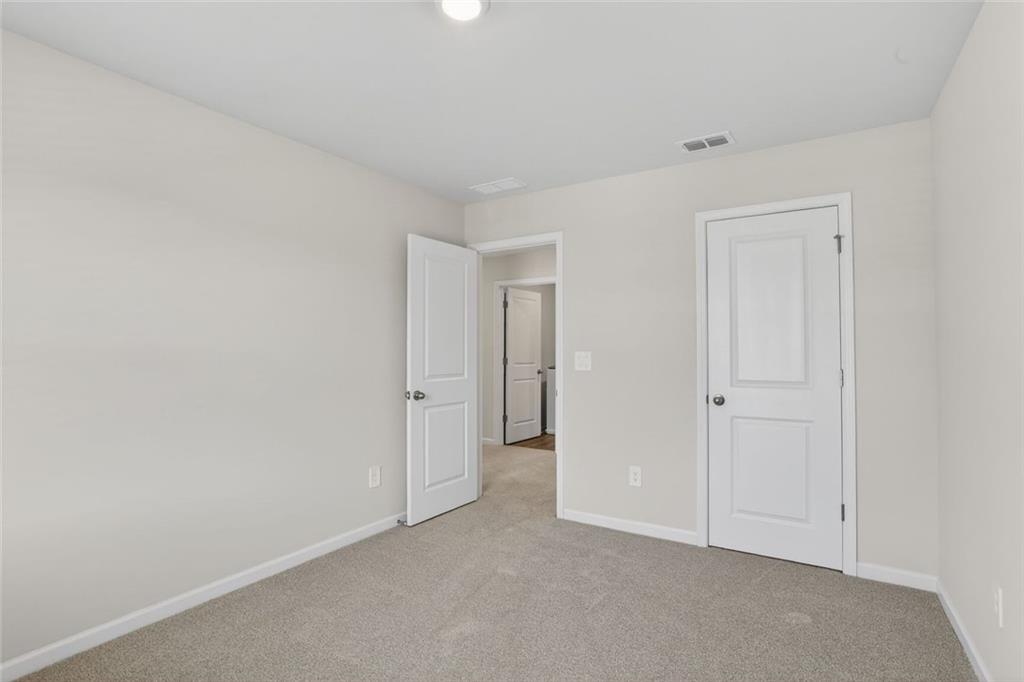 6929 Winchester Place Fairburn, GA 30213 - Photo 28 of 35 a view of an empty room and closet area