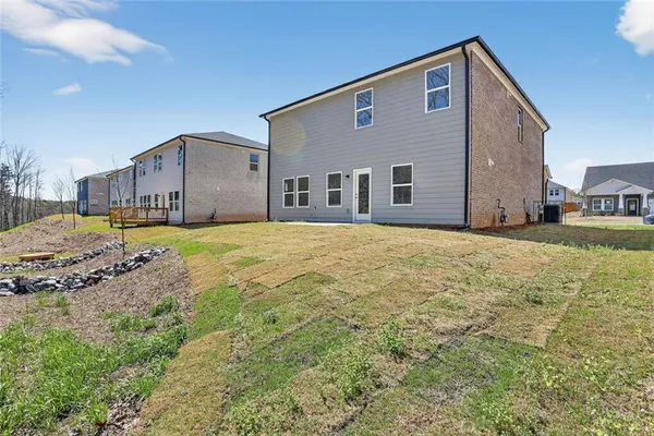 a big house with a big yard and more windows