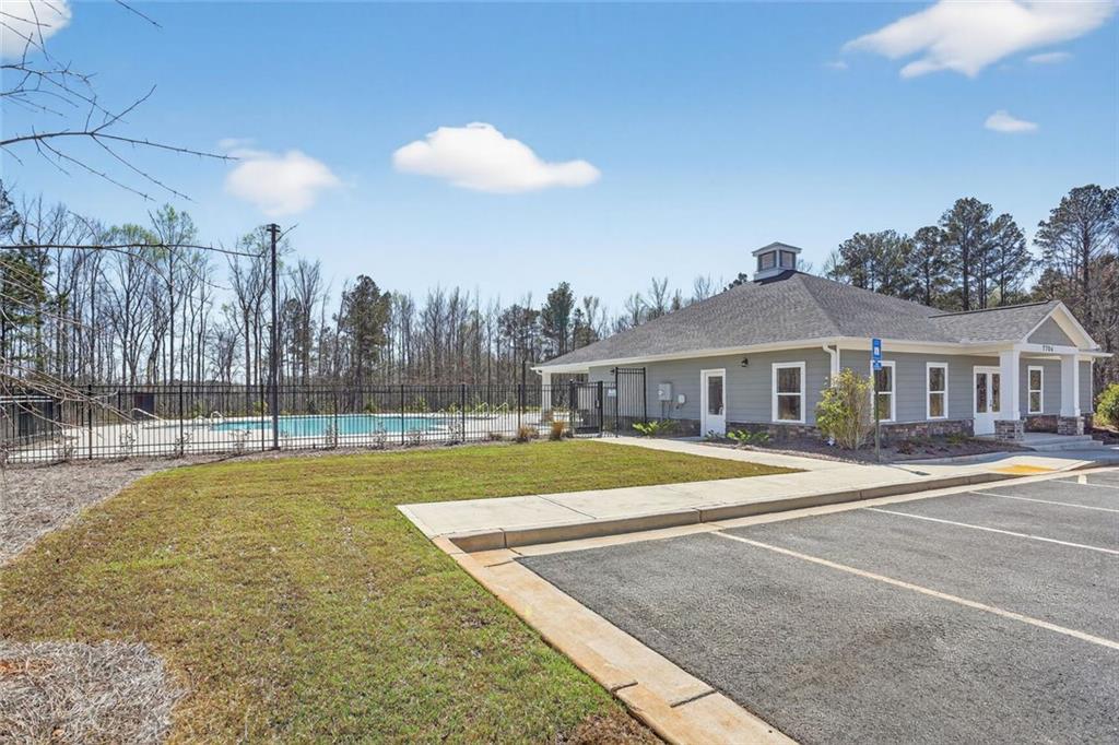 6929 Winchester Place Fairburn, GA 30213 - Photo 34 of 35 a view of a house with swimming pool and a yard