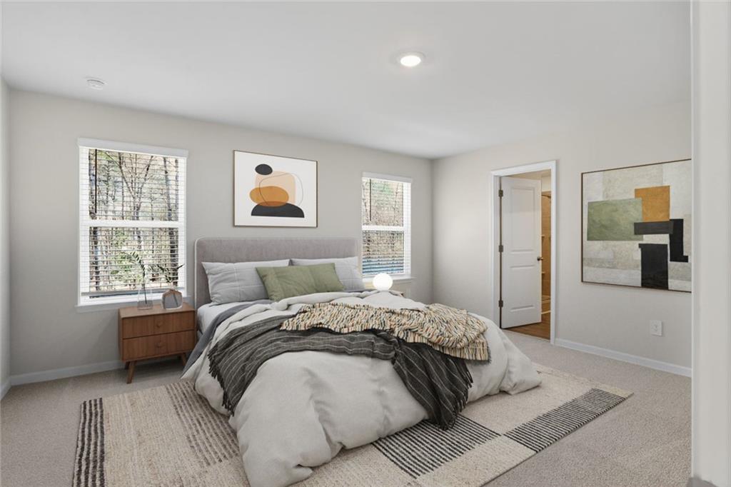 6929 Winchester Place Fairburn, GA 30213 - Photo 8 of 35 a spacious bedroom with a bed and a window